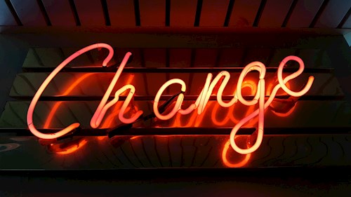 Neon sign that reads Change