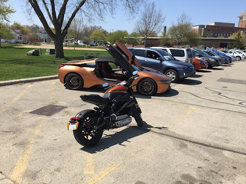 Motorcycle and sports car with wing doors