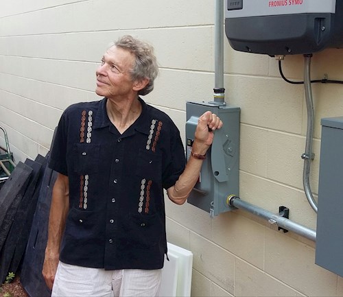 Don Wichert turning on solar panels