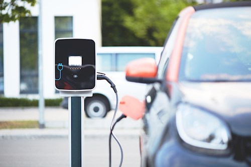 electric vehicle attached to a charging station