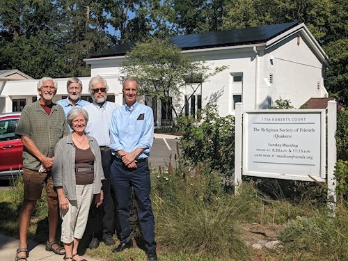 Friends standing in front of Meetinghouse with Joe Parisi