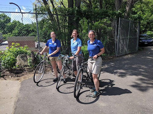 Zoo staff posing with their bikes