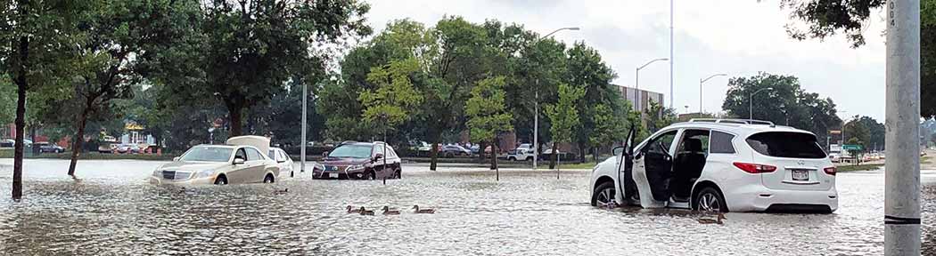 Cars in a flooded parking lot in 2018